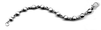 SPHERES $240-sterling silver bracelet with lightly brushed surface (7 1/2" long) SPHERES $240-sterling silver bracelet with lightly brushed surface (7 1/2" long)